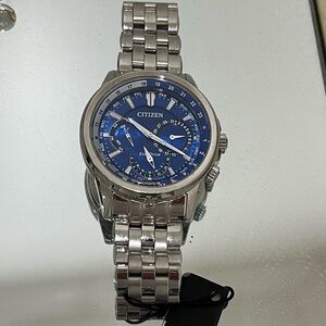RICH, SOPHISTICATED WRIST WATCH.. BRAND NEW CITIZEN WATCH SILVER WITH BLUE BACK